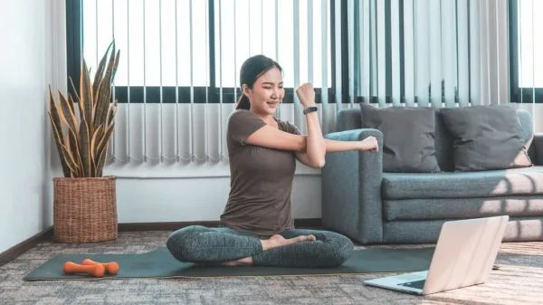 woman performing exercise at home 